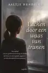 LACHEN DOOR EEN WAAS VAN TRANEN